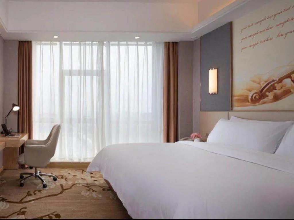 Bed in Vienna Hotel Jiangsu Zhangjiagang Passenger Terminal Station