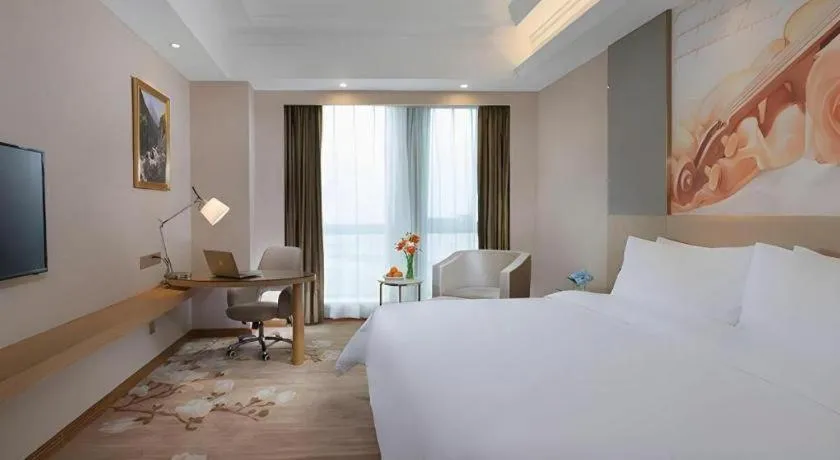 Bed in Vienna Hotel Jiangsu Zhangjiagang Passenger Terminal Station