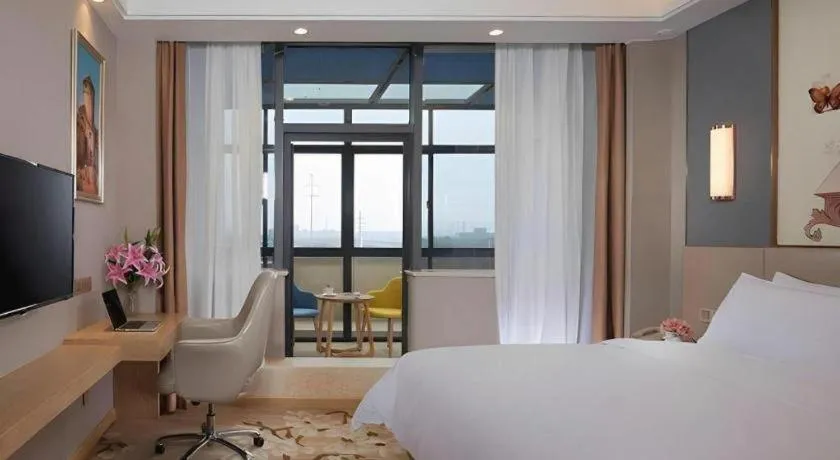 Bed in Vienna Hotel Jiangsu Zhangjiagang Passenger Terminal Station