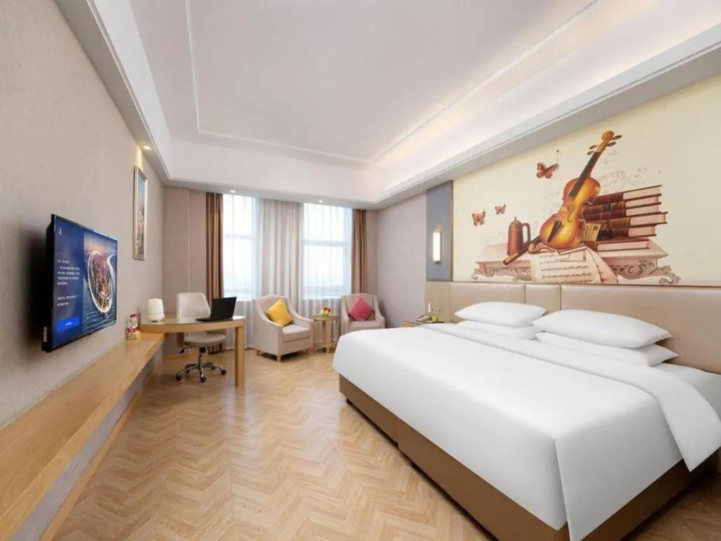 Bed in Vienna Hotel Jiangsu Zhangjiagang Passenger Terminal Station