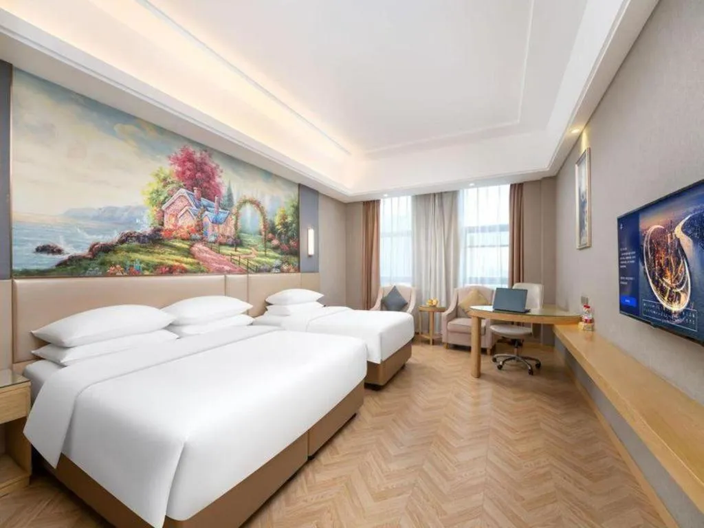Bed in Vienna Hotel Jiangsu Zhangjiagang Passenger Terminal Station
