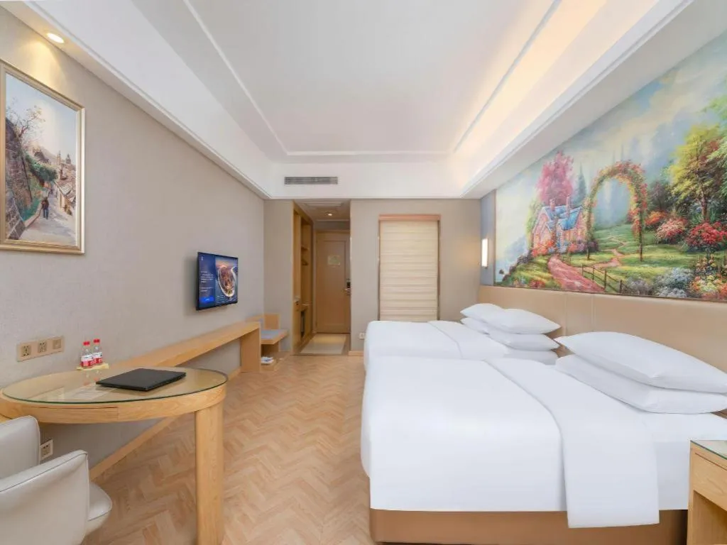 Bed in Vienna Hotel Jiangsu Zhangjiagang Passenger Terminal Station