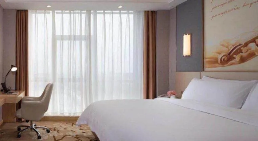 Bed in Vienna Hotel Jiangsu Zhangjiagang Passenger Terminal Station