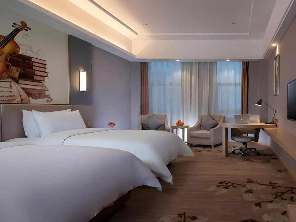 Bed in Vienna Hotel Jiangsu Zhangjiagang Passenger Terminal Station