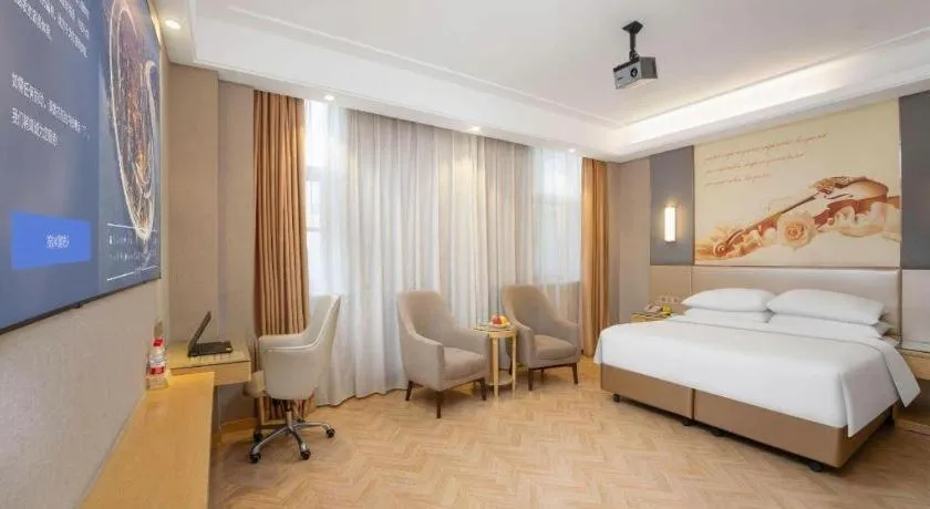 Bed in Vienna Hotel Jiangsu Zhangjiagang Passenger Terminal Station