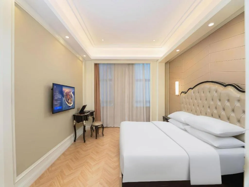 Bed in Vienna Hotel Jiangsu Zhangjiagang Passenger Terminal Station