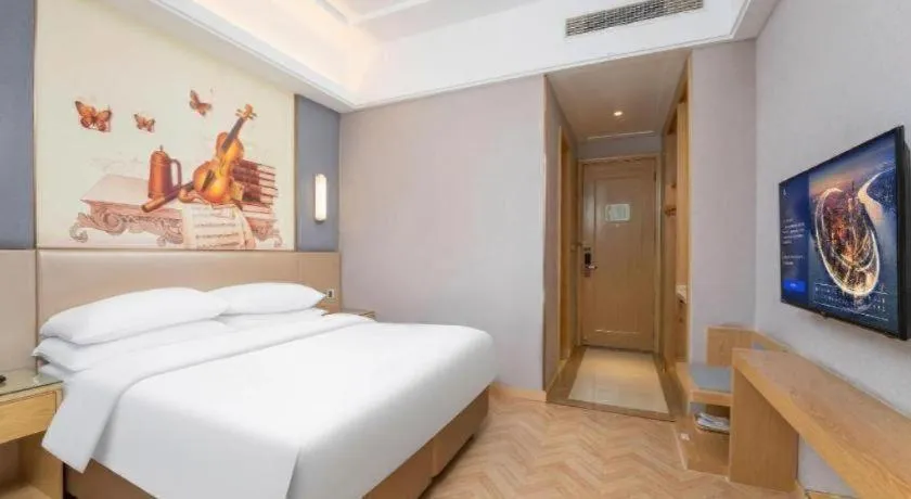 Bed in Vienna Hotel Jiangsu Zhangjiagang Passenger Terminal Station