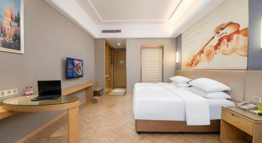 Bed in Vienna Hotel Jiangsu Zhangjiagang Passenger Terminal Station