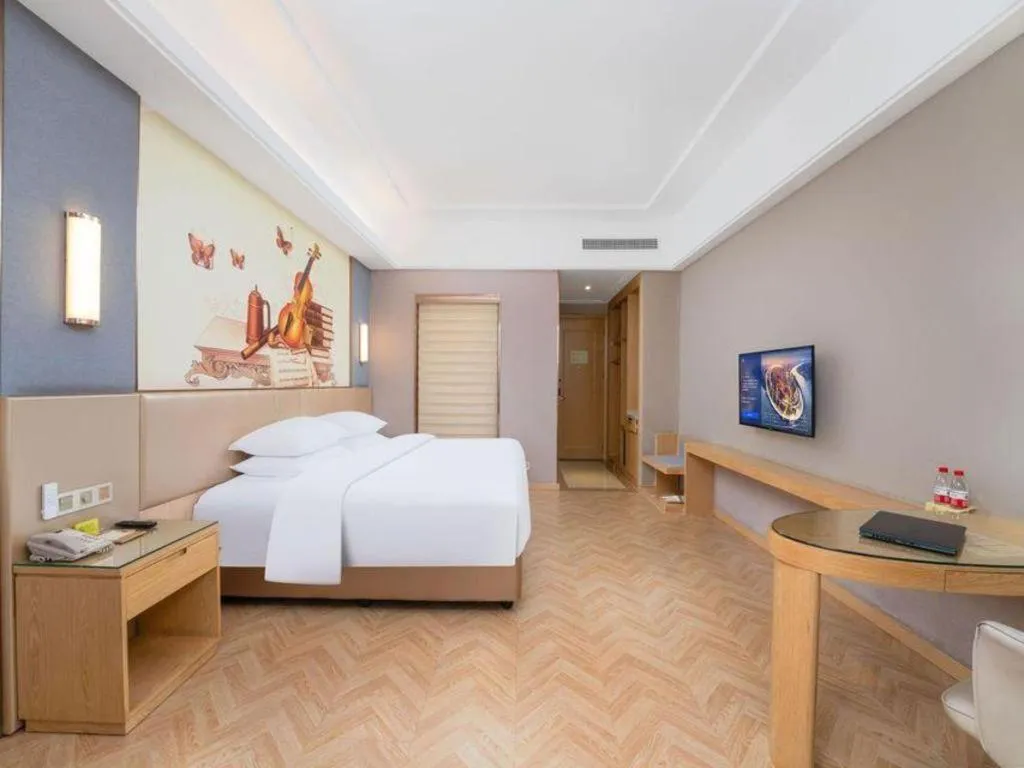 Bed in Vienna Hotel Jiangsu Zhangjiagang Passenger Terminal Station