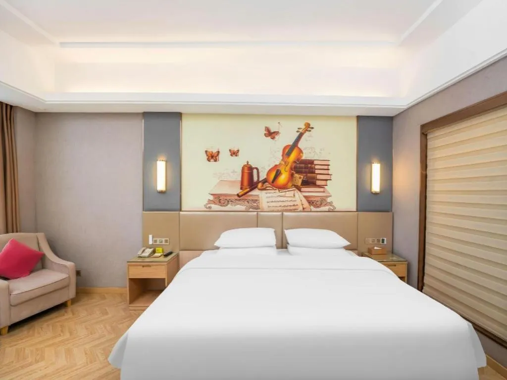 Bed in Vienna Hotel Jiangsu Zhangjiagang Passenger Terminal Station