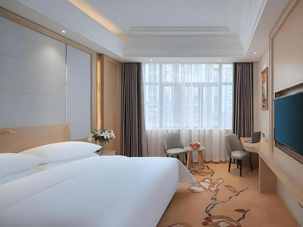 Bed in Vienna Hotel Jiangsu Kunshan Qiandeng Town