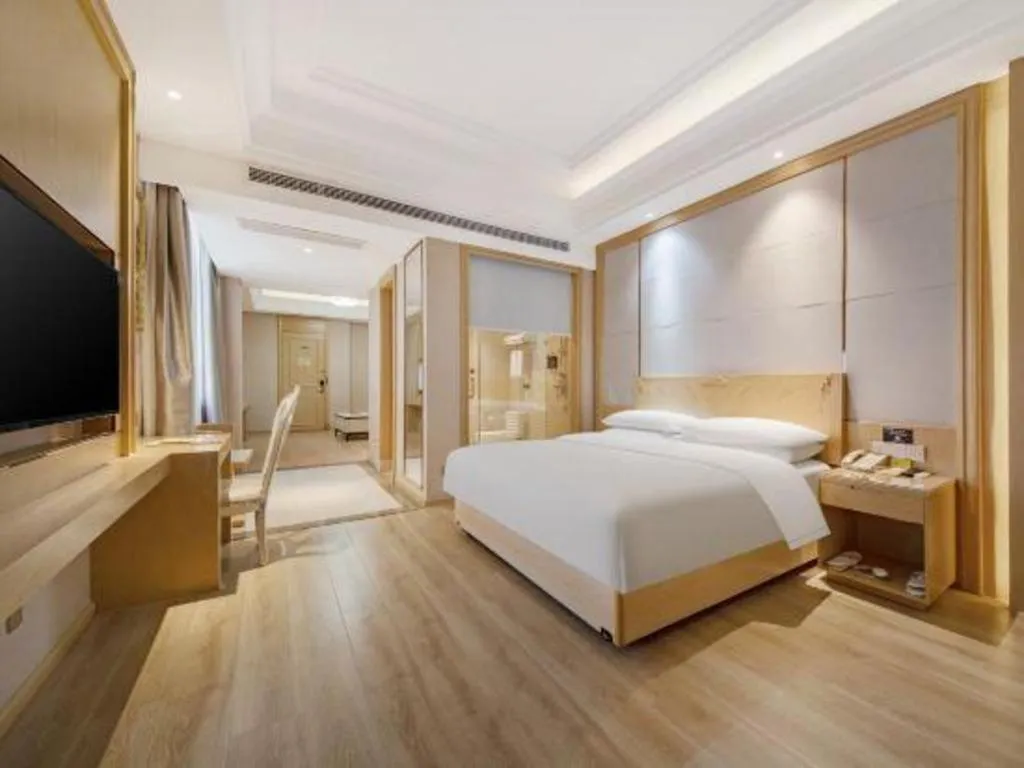 Bed in Vienna Hotel Jiangsu Kunshan Qiandeng Town