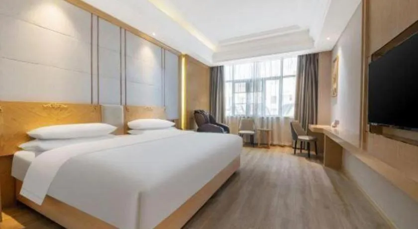 Bed in Vienna Hotel Jiangsu Kunshan Qiandeng Town