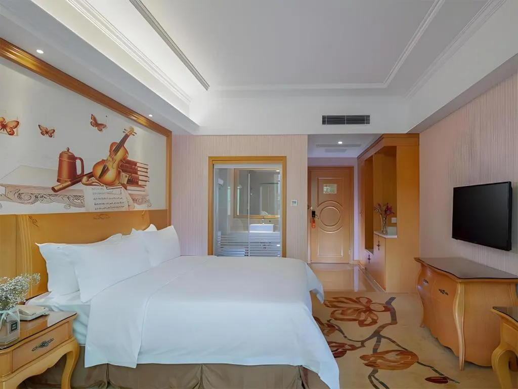 Bed in Vienna Hotel Guangzhou Huadu Sunac Cultural Tourism City Shiling