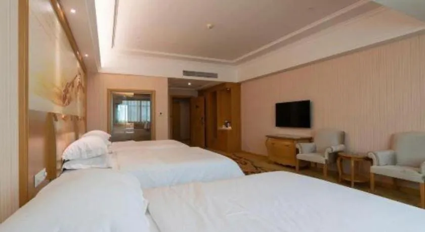Bed in Vienna Hotel Guangzhou Huadu Sunac Cultural Tourism City Shiling