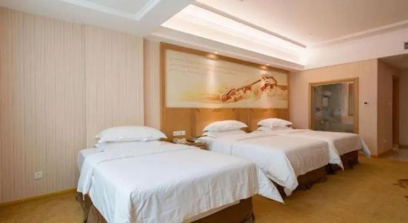 Bed in Vienna Hotel Guangzhou Huadu Sunac Cultural Tourism City Shiling