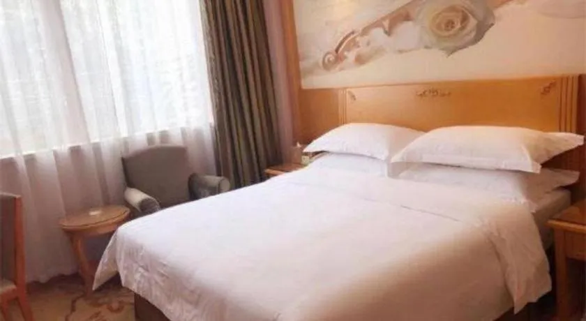Bed in Vienna Hotel Guangzhou Huadu Sunac Cultural Tourism City Shiling