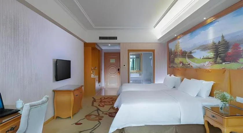 Bed in Vienna Hotel Guangzhou Huadu Sunac Cultural Tourism City Shiling