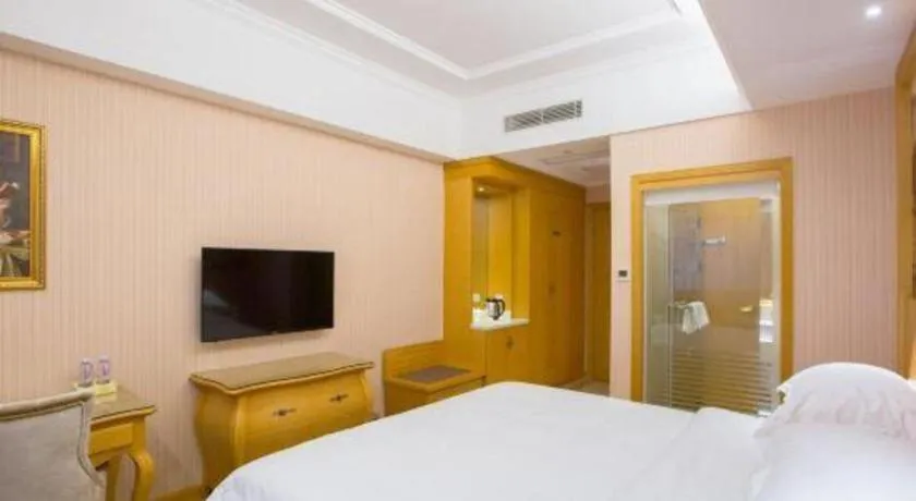 Bed in Vienna Hotel Guangzhou Huadu Sunac Cultural Tourism City Shiling