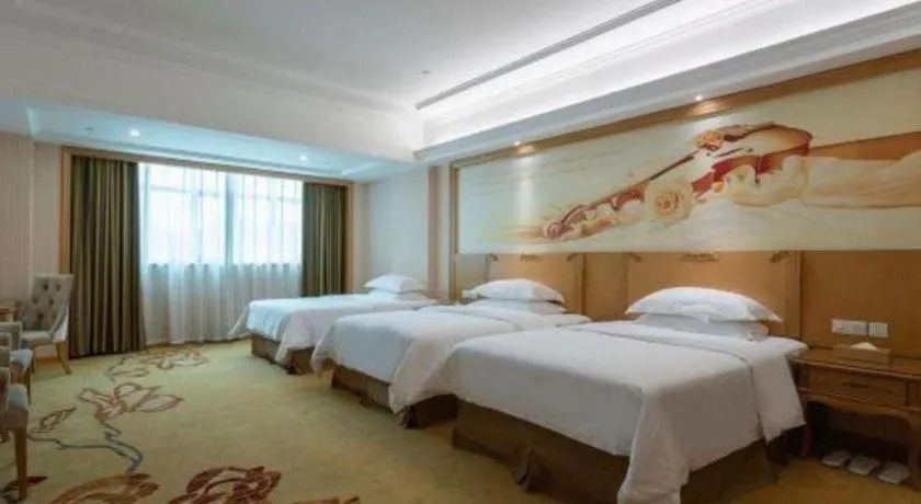 Bed in Vienna Hotel Guangzhou Huadu Sunac Cultural Tourism City Shiling