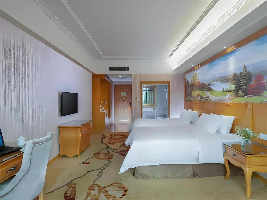 Bed in Vienna Hotel Guangzhou Huadu Sunac Cultural Tourism City Shiling