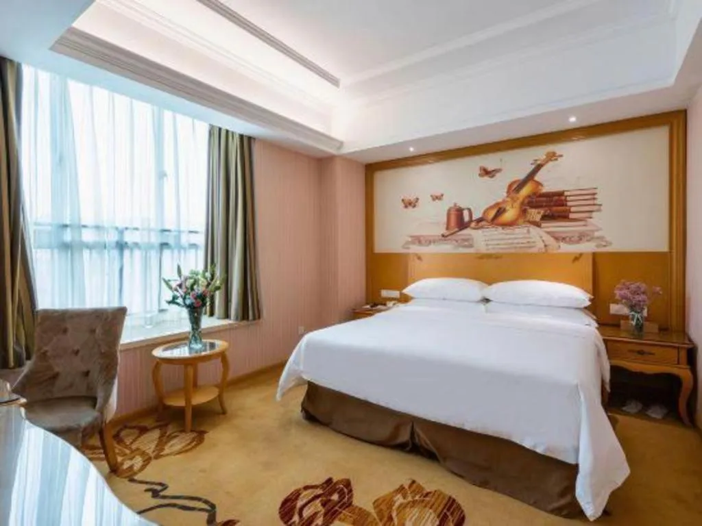 Bed in Vienna Hotel Guangzhou Huadu Sunac Cultural Tourism City Shiling