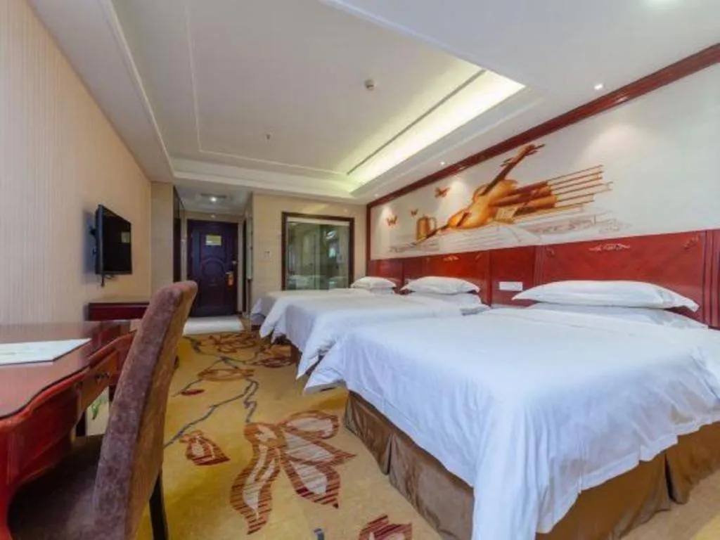 Bed in Vienna Hotel Guangzhou Huadu Sunac Cultural Tourism City Shiling