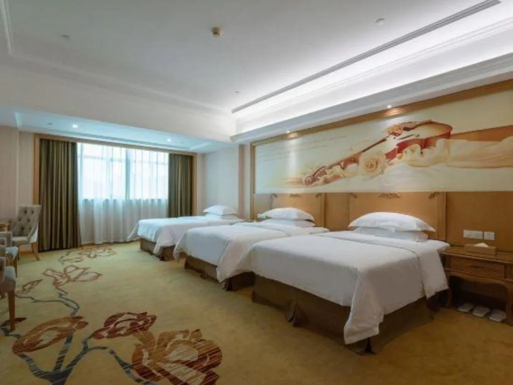 Bed in Vienna Hotel Guangzhou Huadu Sunac Cultural Tourism City Shiling