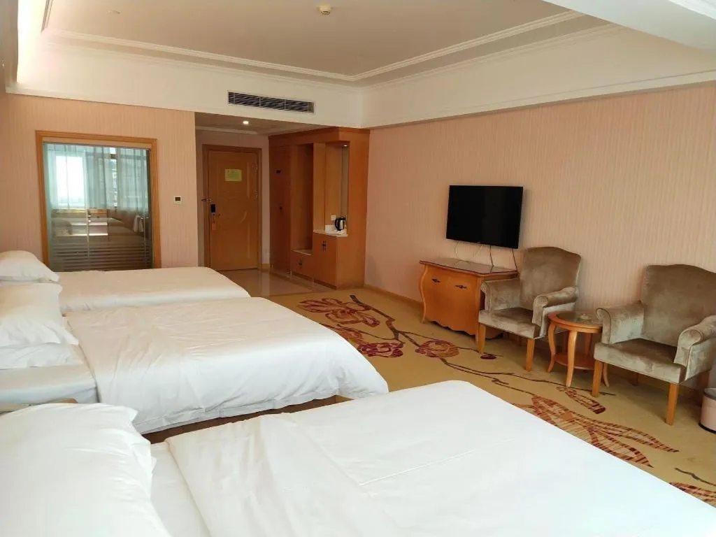 Bed in Vienna Hotel Guangzhou Huadu Sunac Cultural Tourism City Shiling