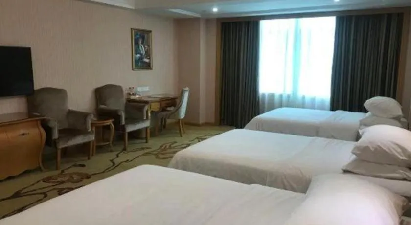 Bed in Vienna Hotel Guangzhou Huadu Sunac Cultural Tourism City Shiling