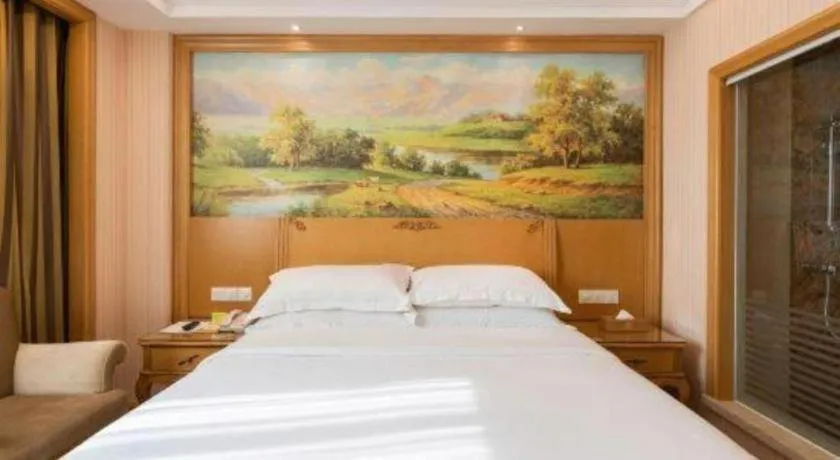 Bed in Vienna Hotel Guangzhou Huadu Sunac Cultural Tourism City Shiling