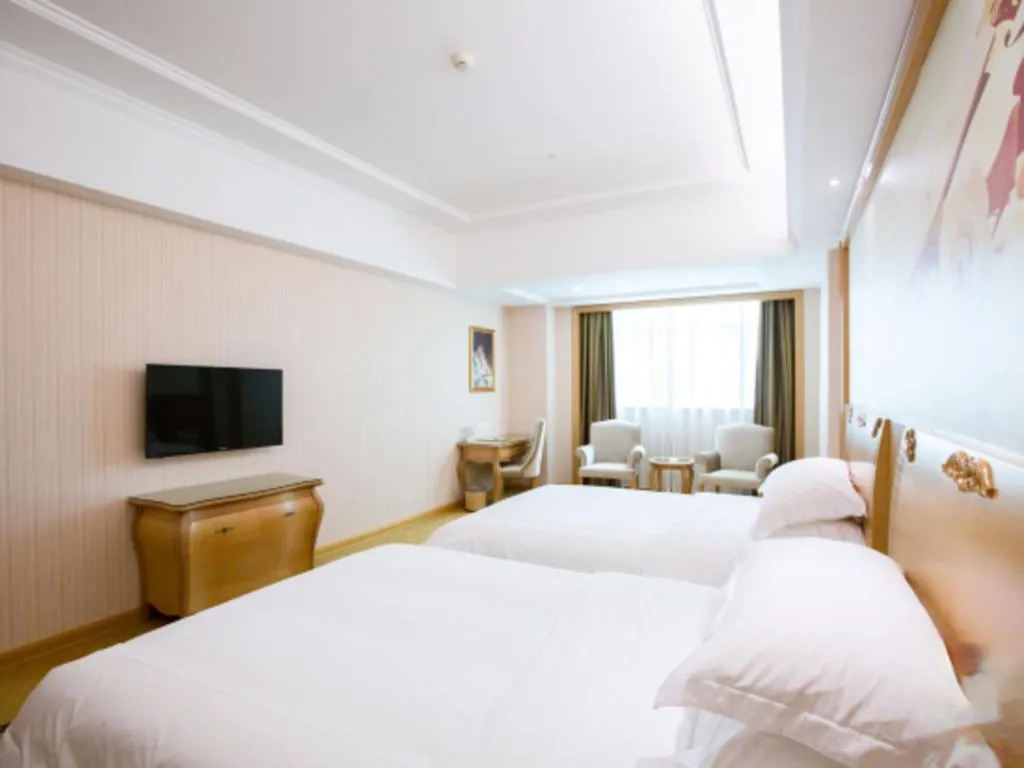 Bed in Vienna Hotel Guangzhou Huadu Sunac Cultural Tourism City Shiling