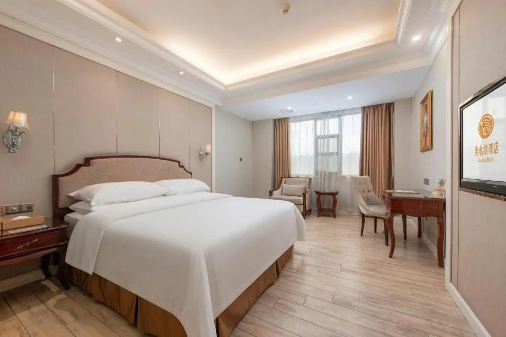 Bed in Vienna Hotel Guangzhou Baiyun College Jinyuan Plaza