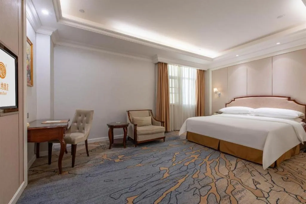 Bed in Vienna Hotel Guangzhou Baiyun College Jinyuan Plaza