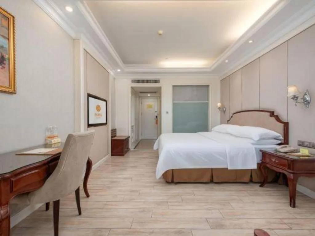 Bed in Vienna Hotel Guangzhou Baiyun College Jinyuan Plaza