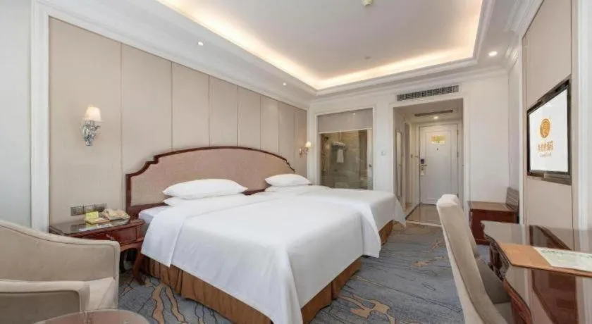 Bed in Vienna Hotel Guangzhou Baiyun College Jinyuan Plaza