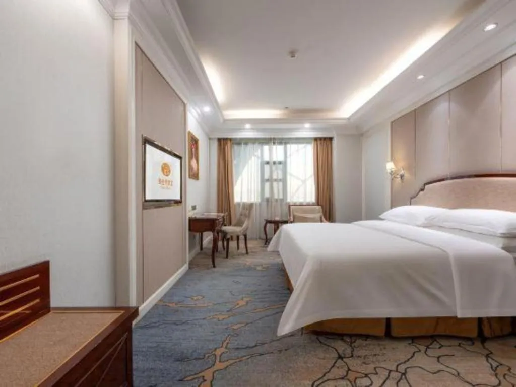 Bed in Vienna Hotel Guangzhou Baiyun College Jinyuan Plaza