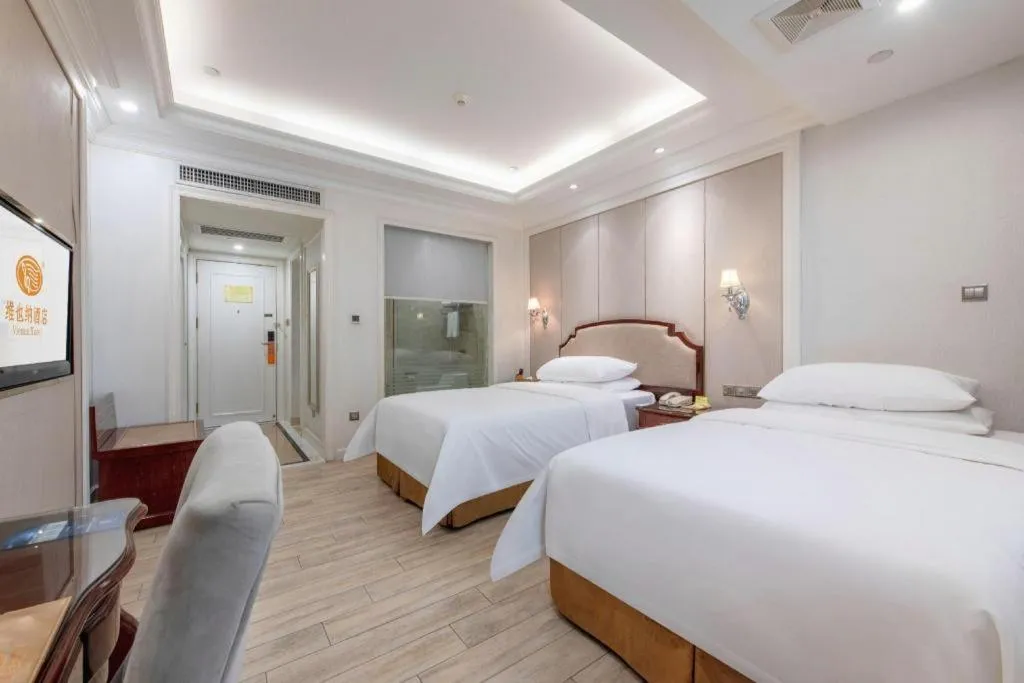 Bed in Vienna Hotel Guangzhou Baiyun College Jinyuan Plaza