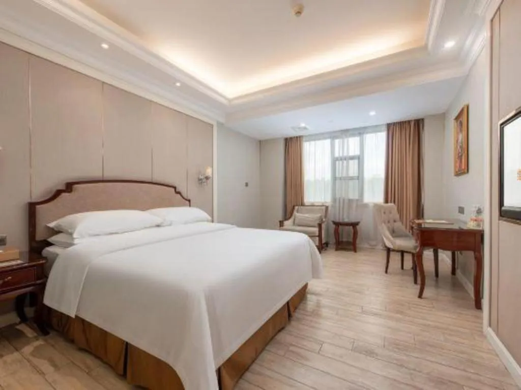 Bed in Vienna Hotel Guangzhou Baiyun College Jinyuan Plaza