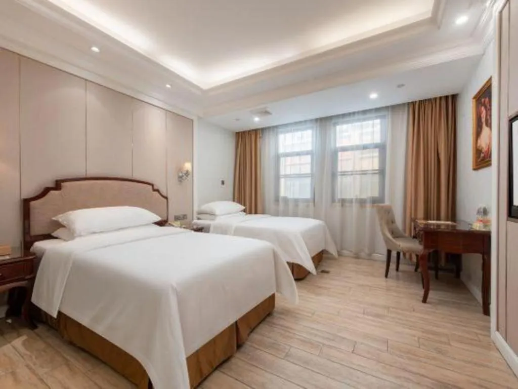 Bed in Vienna Hotel Guangzhou Baiyun College Jinyuan Plaza