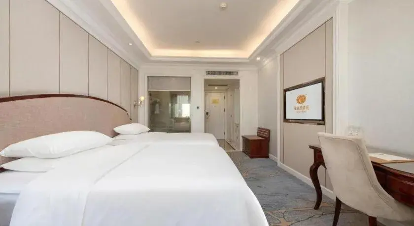 Bed in Vienna Hotel Guangzhou Baiyun College Jinyuan Plaza Bed in Vienna Hotel Guangzhou Baiyun College Jinyuan Plaza