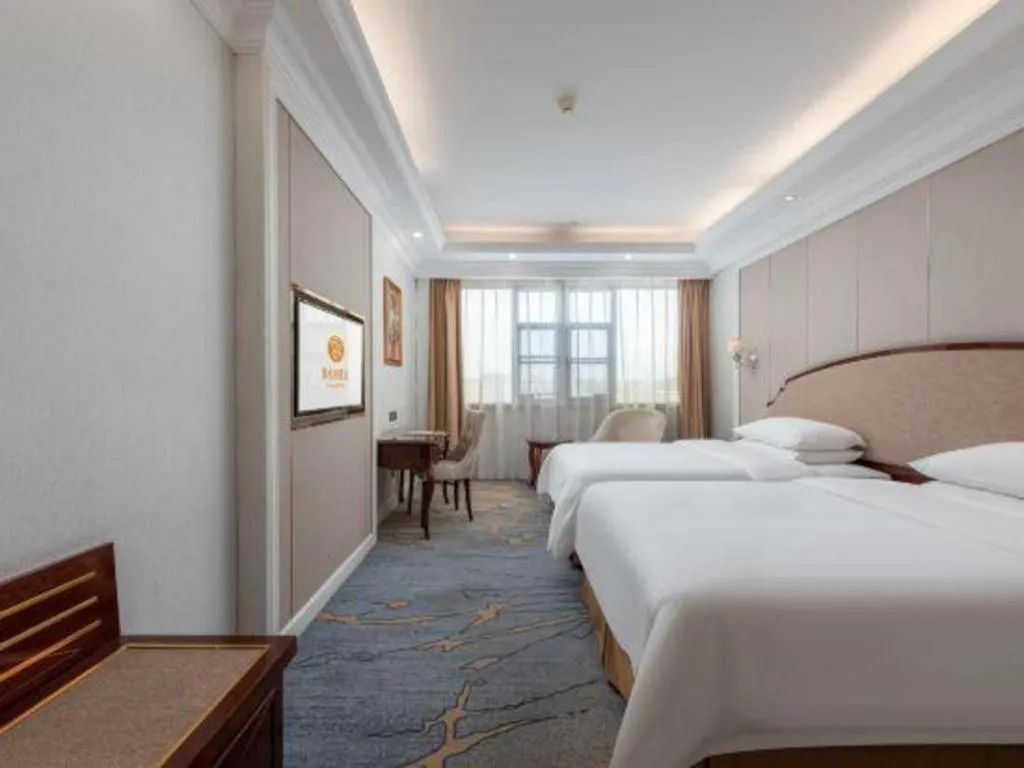Bed in Vienna Hotel Guangzhou Baiyun College Jinyuan Plaza