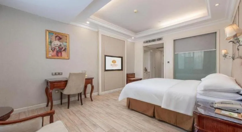 Bed in Vienna Hotel Guangzhou Baiyun College Jinyuan Plaza