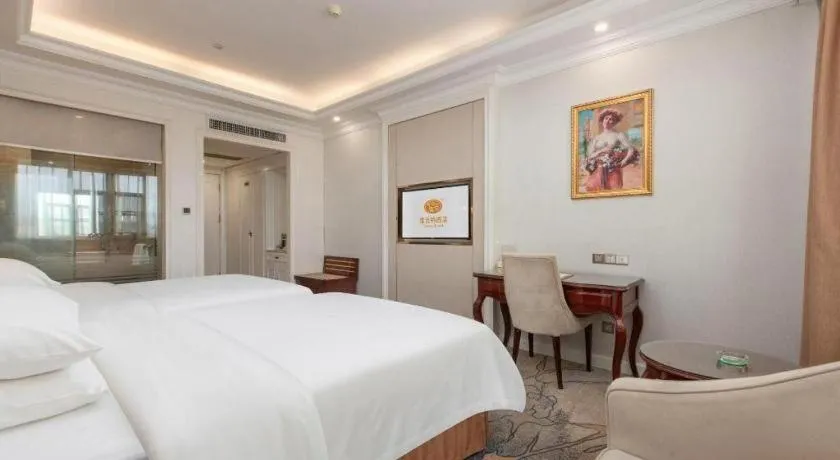 Bed in Vienna Hotel Guangzhou Baiyun College Jinyuan Plaza