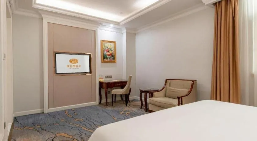 Bed in Vienna Hotel Guangzhou Baiyun College Jinyuan Plaza