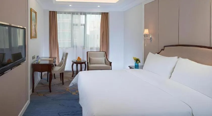 Bed in Vienna Hotel Guangzhou Baiyun College Jinyuan Plaza