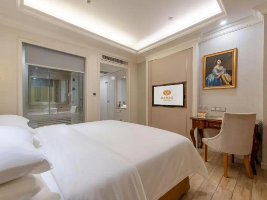 Bed in Vienna Hotel Guangzhou Baiyun College Jinyuan Plaza