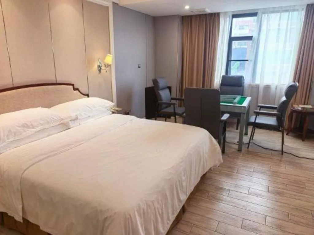 Bed in Vienna Hotel Guangzhou Baiyun College Jinyuan Plaza