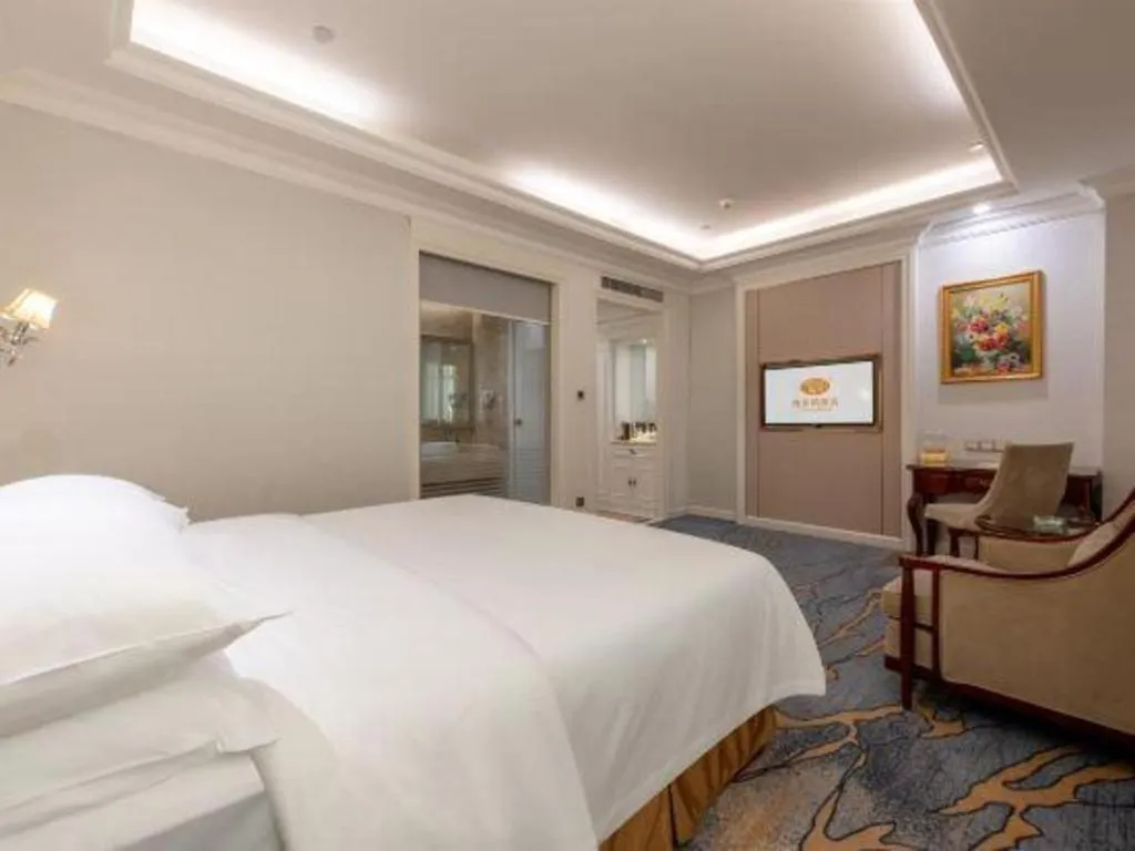 Bed in Vienna Hotel Guangzhou Baiyun College Jinyuan Plaza