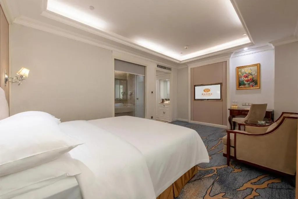 Bed in Vienna Hotel Guangzhou Baiyun College Jinyuan Plaza